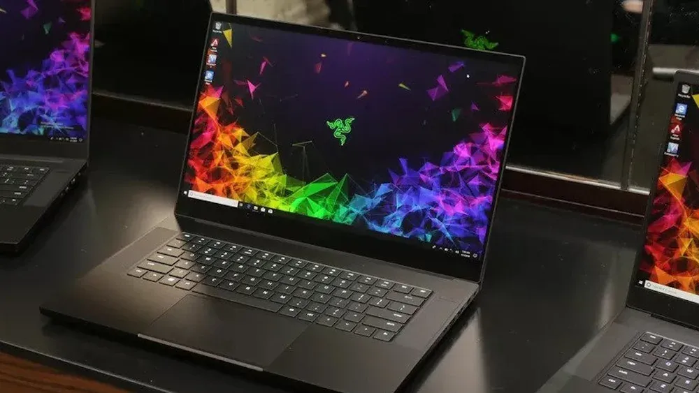 Laptops sitting in a line on a table