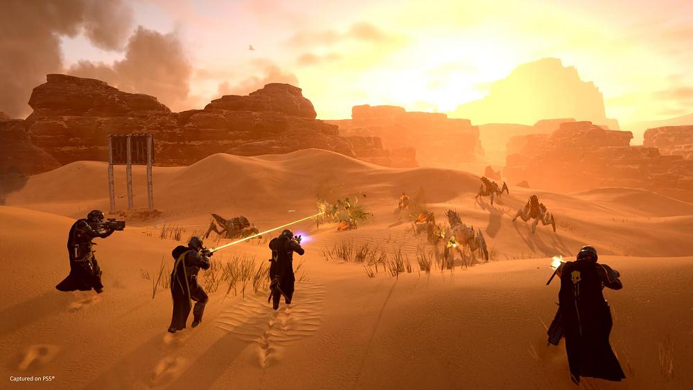 Super space soldiers from Earth fighting alien bugs on a sand filled desert alien planet.