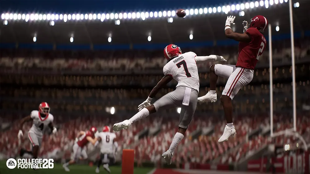 A college football player making a jumping catch.