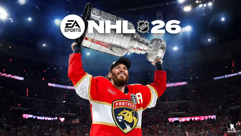 A hockey player holding up a big cup.