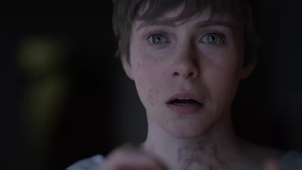 A virtual Sophia Lilis looking extremely scared with tears in her eyes.
