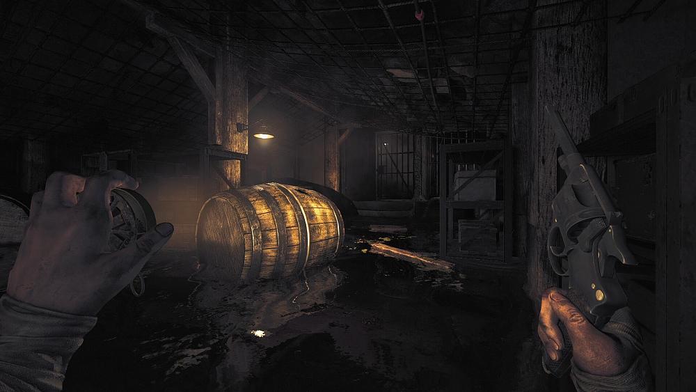 First-person view of a person holding a gun and a flashlight. The view is of a partially flooded underground bunker room with a large wooden barrel, boxes on metal shelves, and wooden support beams.