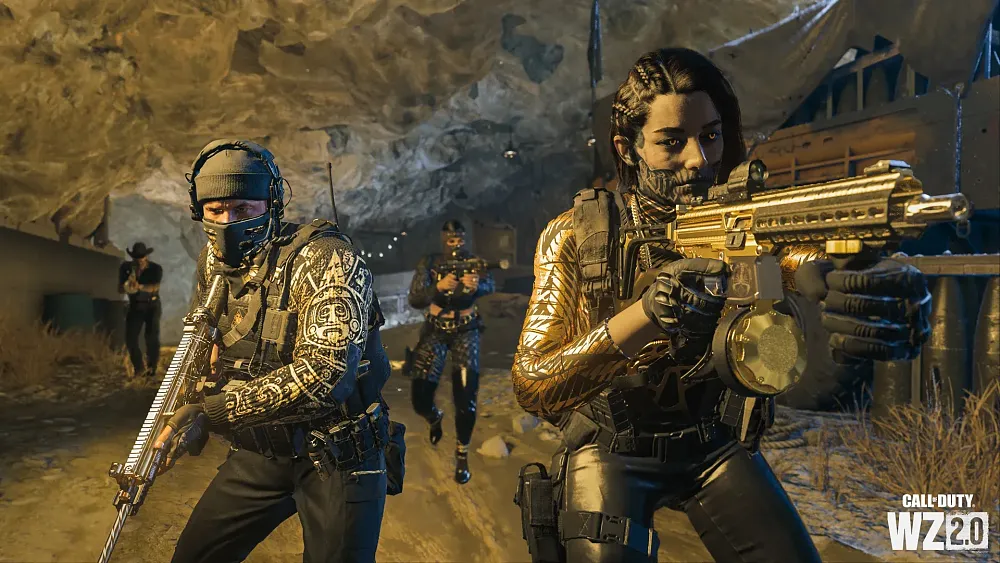 Heavily armed people with gold and black armor and various tattoos aiming weapons like assault rifles and the like.