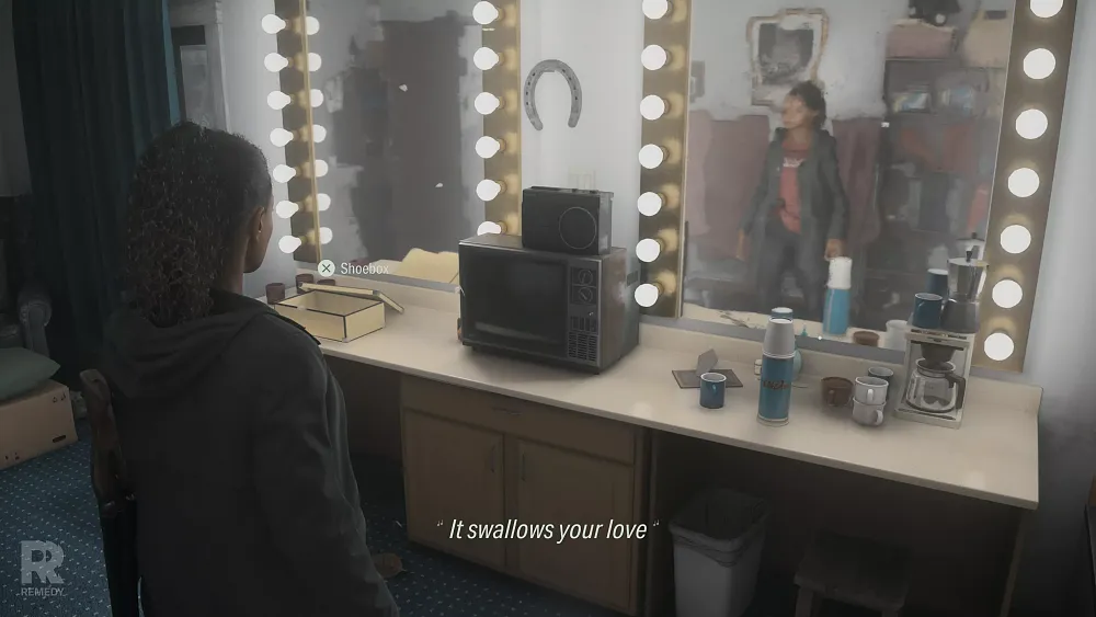 A woman stands near a mirror showing her reflection as an example of raytracing technology added to Alan Wake 2.