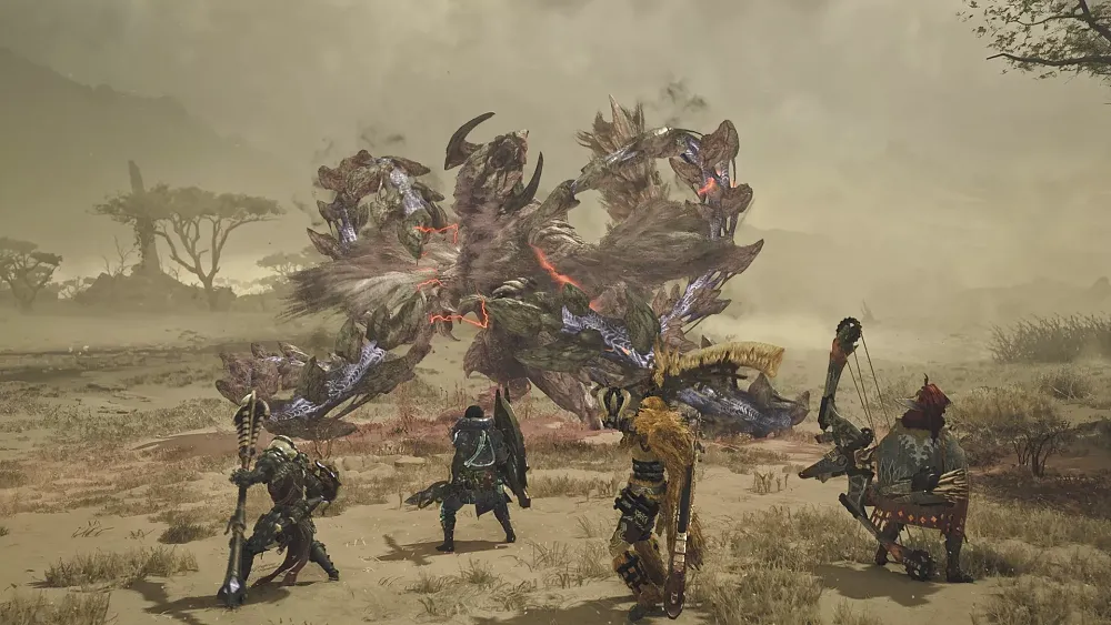 Four hunters taking on a big creature thing in a desert.