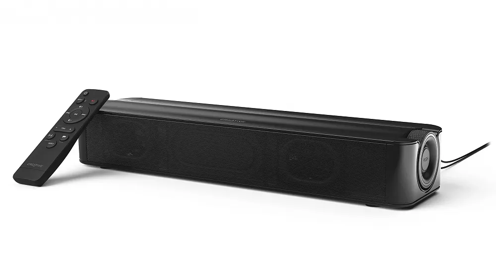 A small audio soundbar with remote set against a white background.