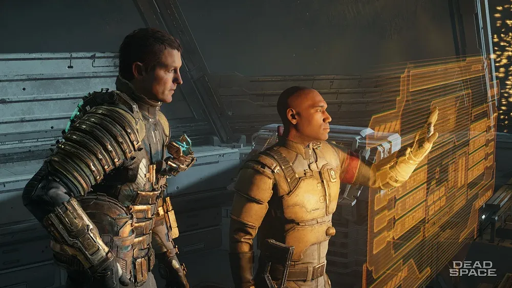 Screenshot from the Dead Space remake. On the left stands a man in futuristic sci-fi armored space suit without a helmet. Next to him is a bald man. Both are facing the right, looking at a floating holographic interface.