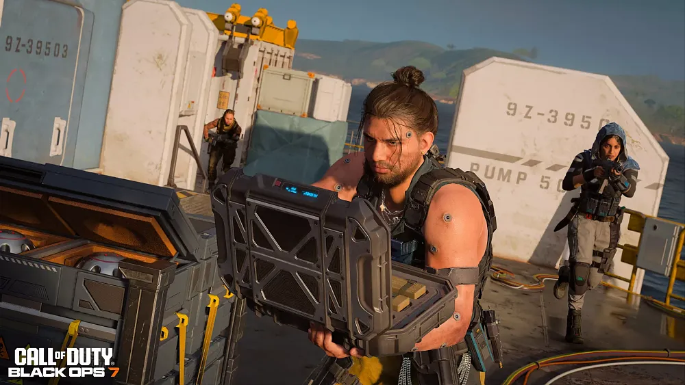 Three soldiers from Call of Duty: Black Ops 7. The man in the front is sporting a manbun and accessing a high-tech military case with gear inside.