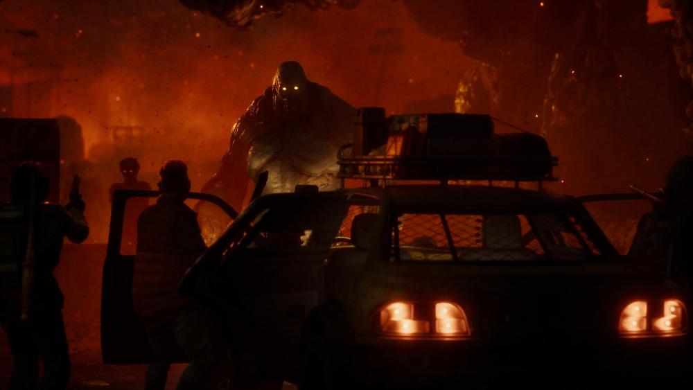 Survivors getting out of a car in front of a horde of zombies, including one very large, very fat zombie.
