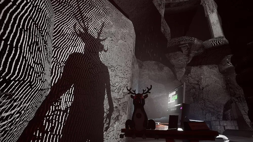 Image showing a creepy shadow cast by a monitor and little deer plush doll.