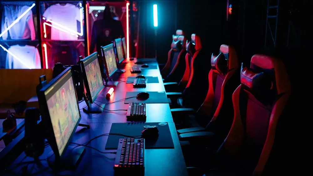 Image of desktop PCs lined up at an esports event. Image is from pexels.com.