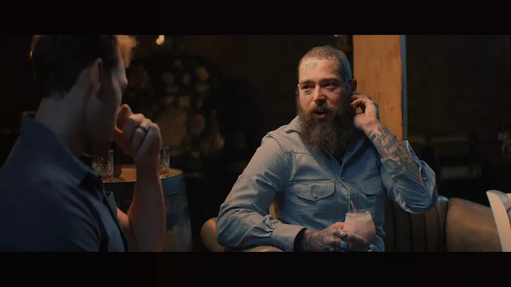 Post Malone during a Q&A with another person.