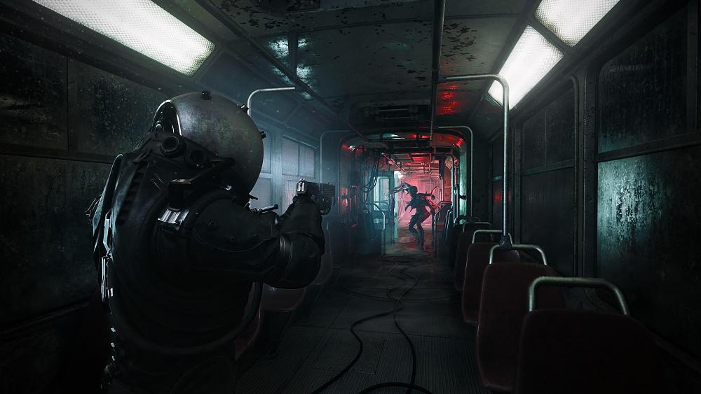 A person in a full environmental or diving suit aiming down the length of a subway car at some sort of deformed creature.