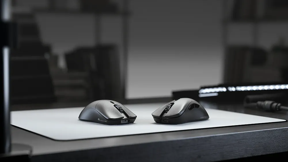 Two high-end gaming mice sitting on a desk.