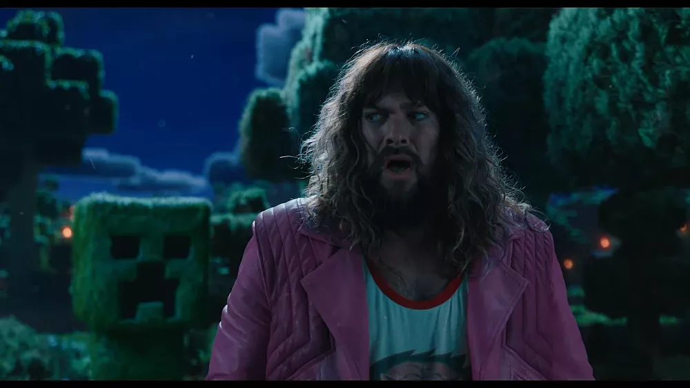 Jason Momoa looking over his shoulder at a Minecraft Creeper.