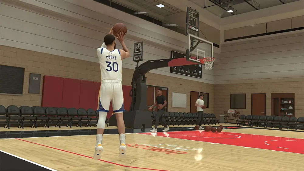 A basketball player takes a shot from beyond the 3-point line in a mostly empty gymnasium.