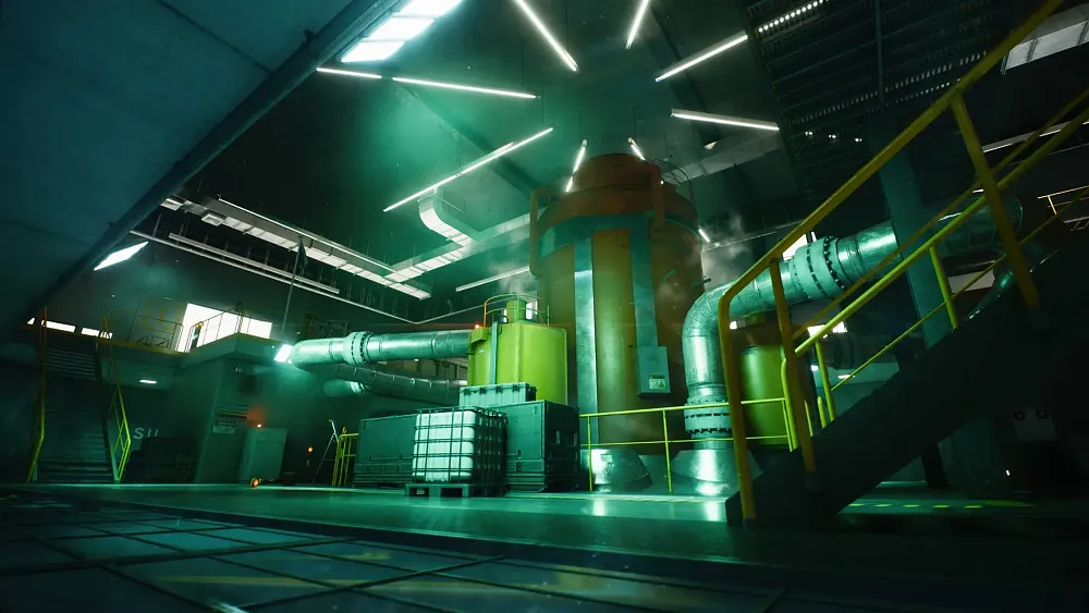 Inside a large room looking at something that looks like a large power turbine with several large pipes going into and out of it.