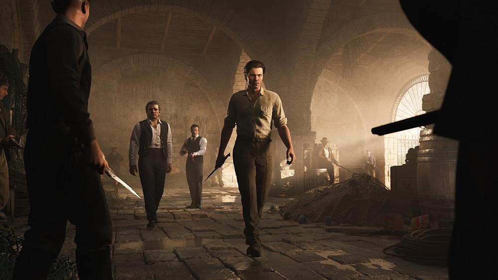 A group of Mafia members with guns and knives about to face off inside of a stone storehouse in 1900s Siciily.