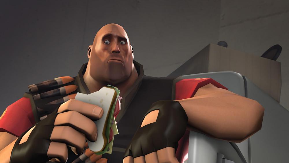 A bald, heavy man looks alarmed. There is a sandwich being held in his hand.