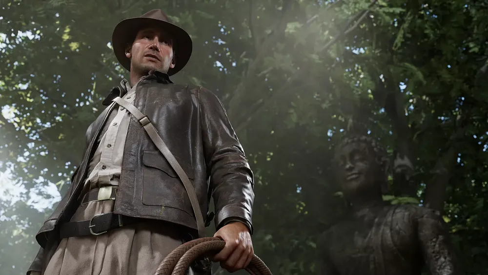 Indiana Jones holding a whip, wearing his brown leather jacket and hat, and standing in a jungle.