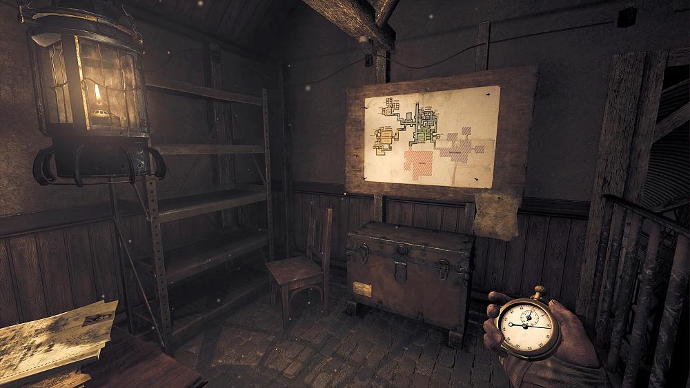 View of someone holding a stopwatch in their right hand looking at a map on a wall in front of them.