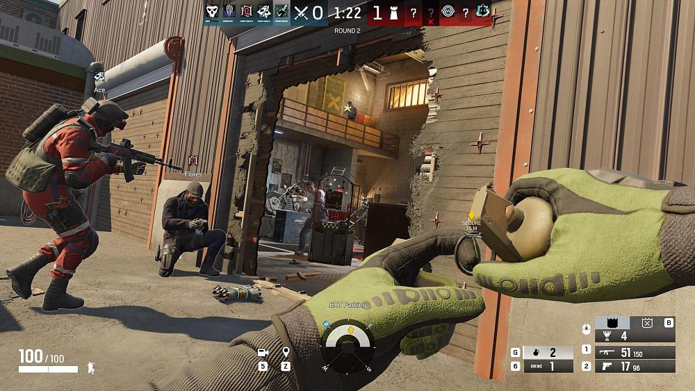 Screenshot from Rainbow Six Siege X of a character getting ready to pull the pin on a grenade as other characters and players engage in a gun fight.
