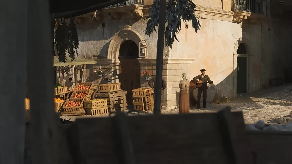 A man in old Sicily playing a guitar for a couple on a street corner.