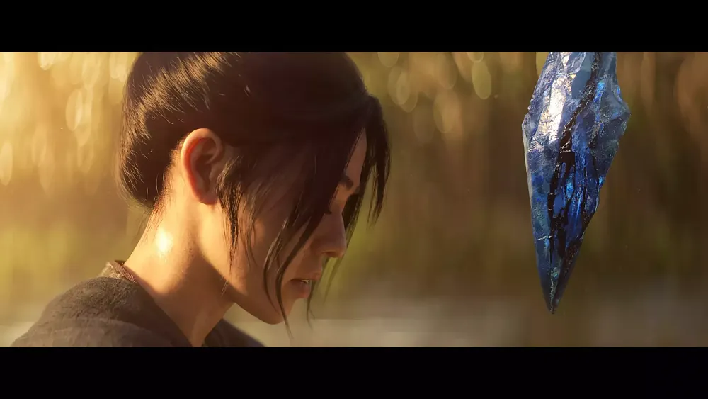 A woman, eyes closed, as a blue demonic crystal hovers inches from her face.