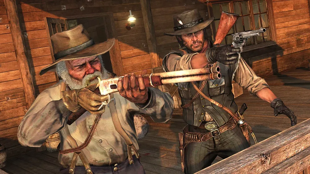 PC screenshot of Red Dead Redemption  showing two cowboys, one very old, readying weapons such as a shotgun and revolver.