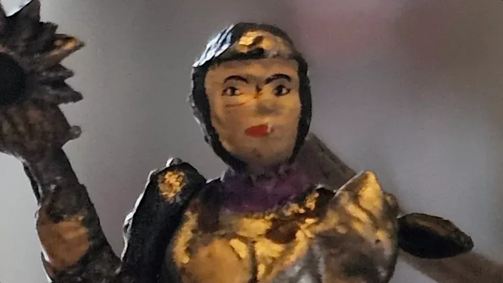 A terrible mini figurine of Shadowheart from Baldur's Gate 3.