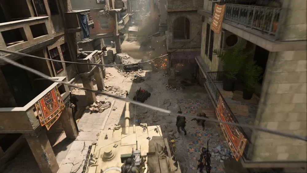 Semi-overhead view of a big military battle in a sandy village.