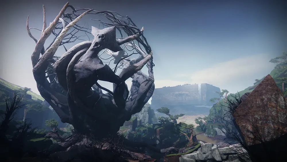 A dead tree containing the shape of some sort of multi-eyed creature in a spherical enclosure. All on a planet as part of the environment.