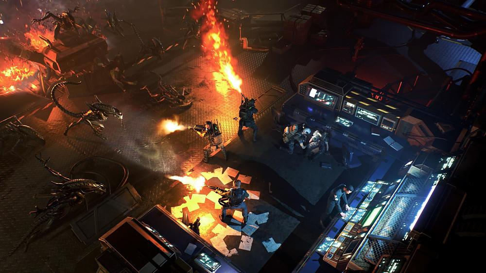 Screenshot from Aliens: Dark Descent showing marines firing weapons at alien Xenomorphs.