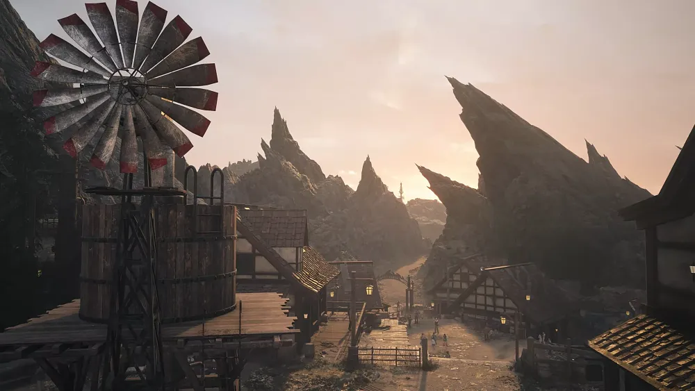 An elevated view of a dry, dusty, small town with a windmill.