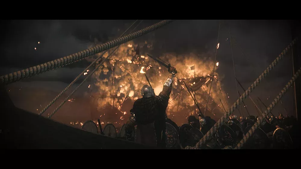 A warrior raising a sword on a boat as fire and brimstone rain down around.
