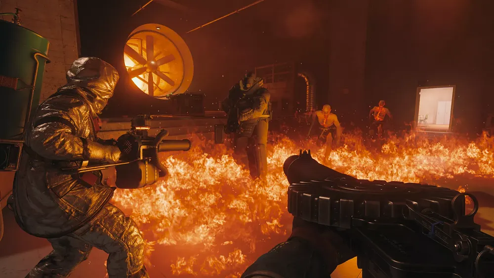 A couple of employees in makeshift gear are battling foes in a fire-filled industrial style room.