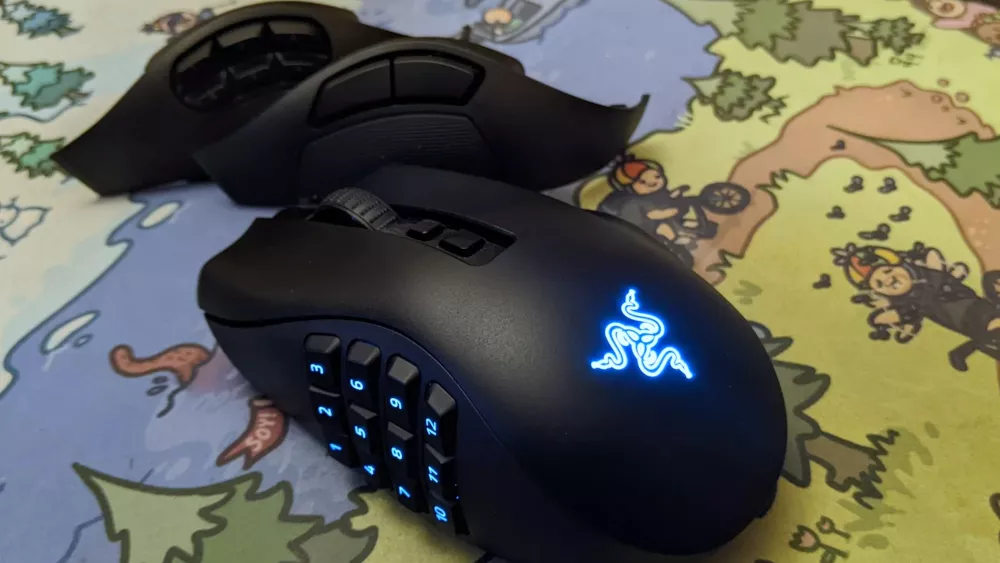 A mouse with additional side plates called the Razer Naga V2 Pro. It is sitting on a colorful mousepad.