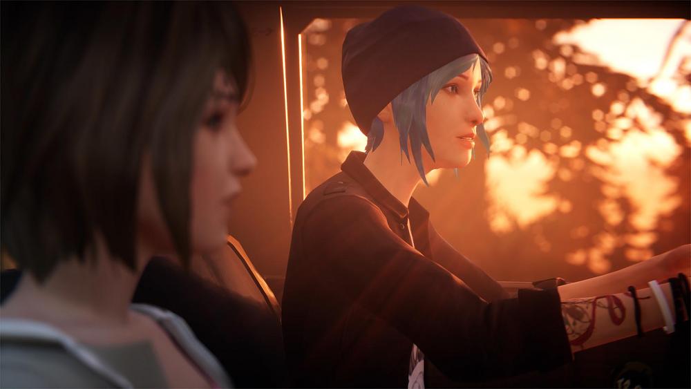 Screenshot showing a blue haired girl and her equally young friend driving in a car.