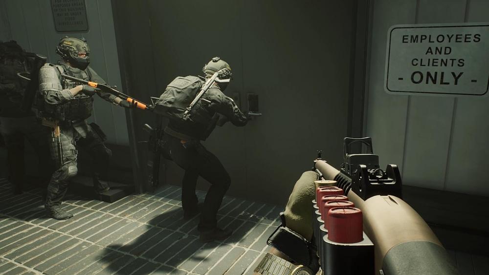 A group of SWAT members preparing to breach a door.