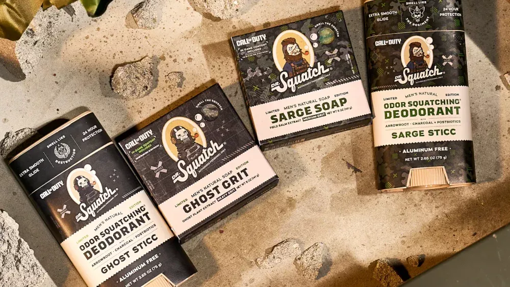 A photo of two bars of natural soap and two sticks of deodorant from Dr. Squatch that are Call of Duty themed.