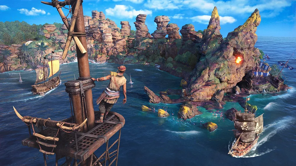 A pirate looks out from a crow's nest on a pirate ship. There is a blue bay surrounded by tall jagged rocks. Other pirate ships can be seen sailing in the bay below.