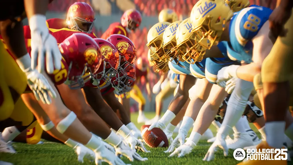 Two college football teams at the line of scrimmage ahead of the ball snap.