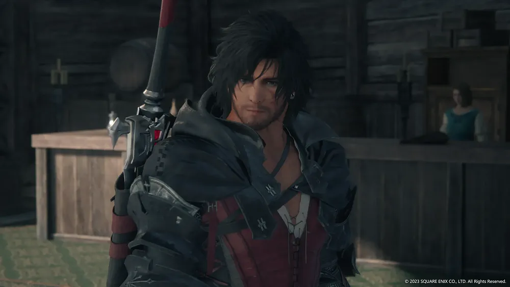 A man with long hair, cloth armor, and a sword looking at the camera.