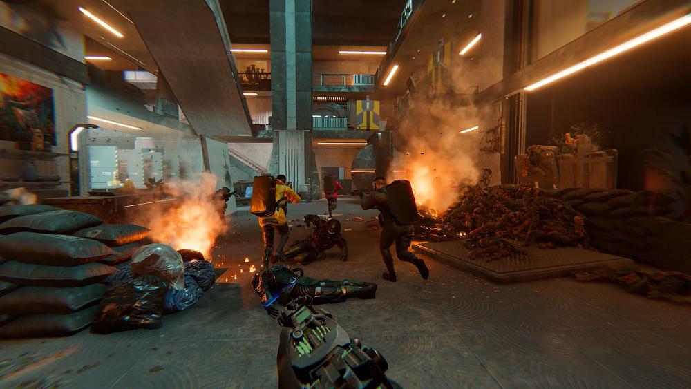 A crew of heavily armed heisters running through a multi-story building with some areas on fire.