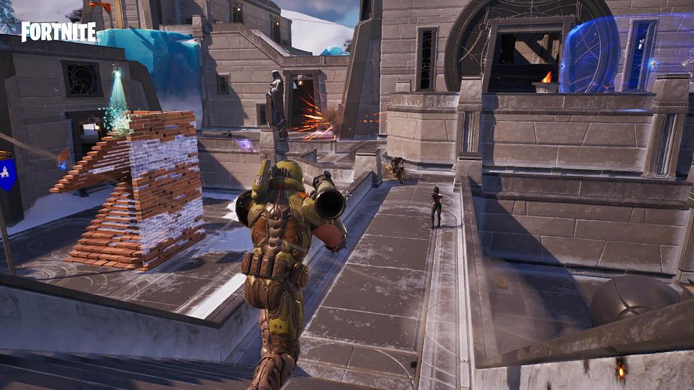 Screen from Fortnite showing Doom Slayer charging forward with an RPG being held while other mayhem from enemy combat happens around him