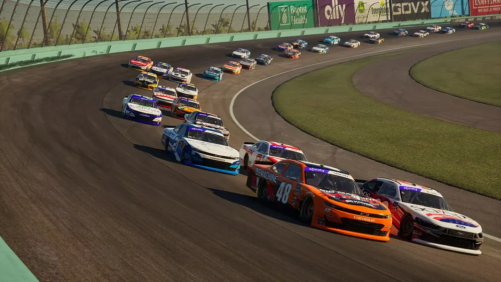 NASCAR race cars driving around on a track.