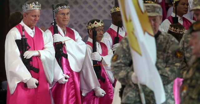"Worshippers clutching AR-15 rifles and some wearing bullet crowns, participated in a commitment ceremony today at World Peace and Unification Sanctuary, in Newfoundland, Pa. The event led a nearby school to cancel classes for the day."