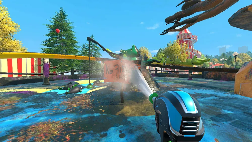 First-person view of power washing a carnival attraction that looks like a children's rollercoaster.