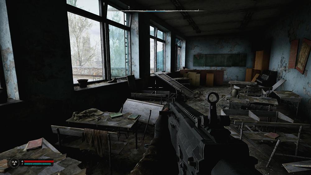 First-person view of someone holding some sort of auto rifle and walking through an extremely rundown, old classroom.