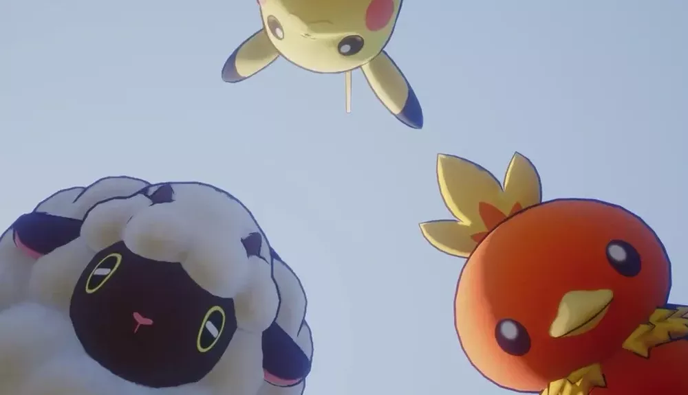 A trip of Pokemon creatures staring down at the viewers.